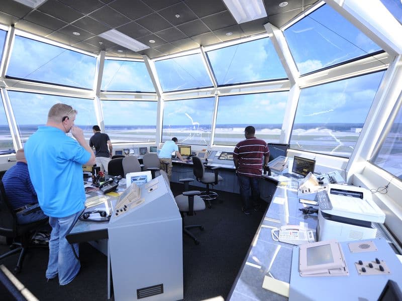 Controllers at work inside an air traffic control tower